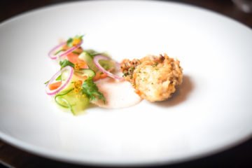Fried Oysters from Norway with pickled Cucumber and spicy Buttermilk